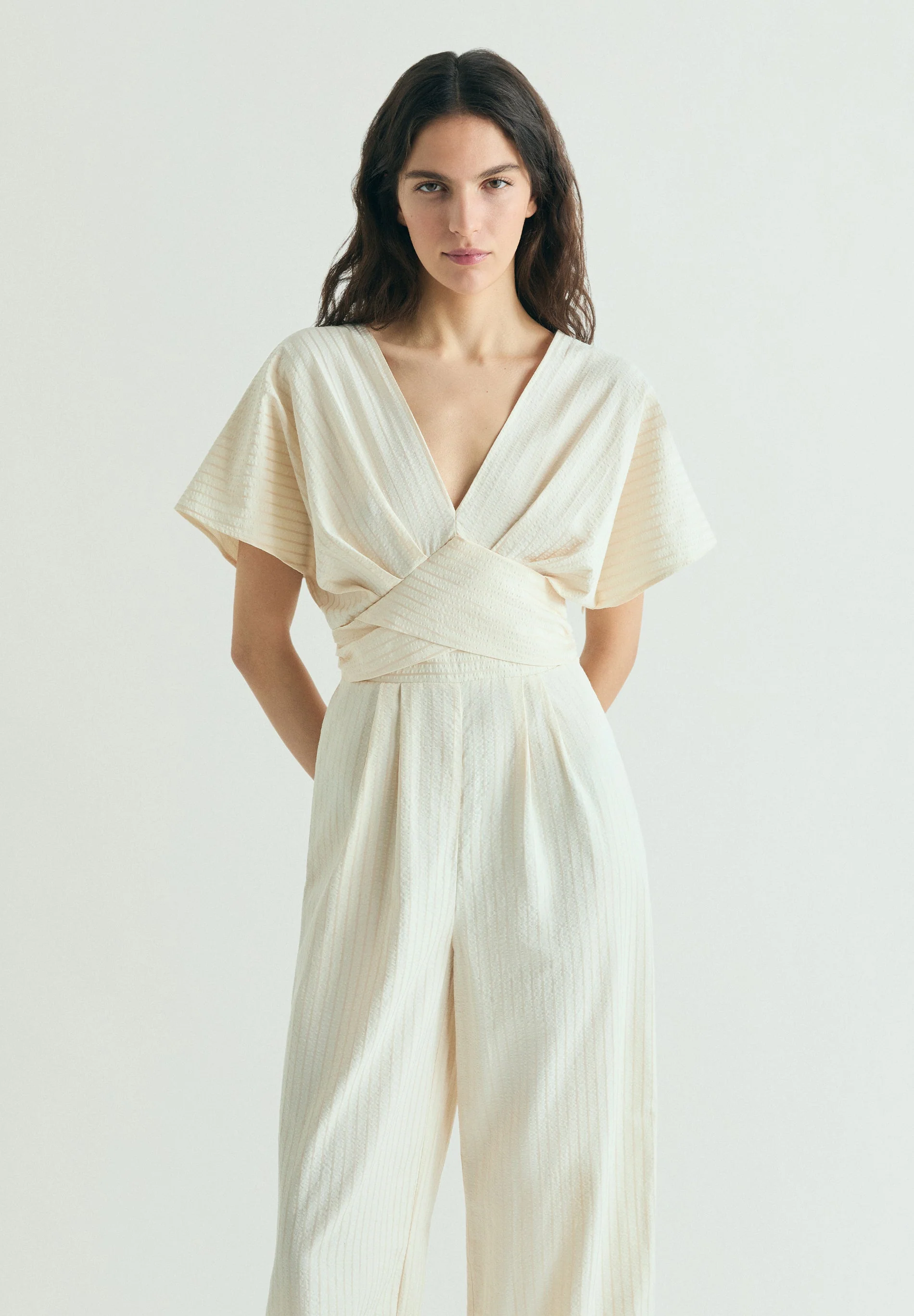 STRIPED JUMPSUIT WITH CROSSOVER WAIST