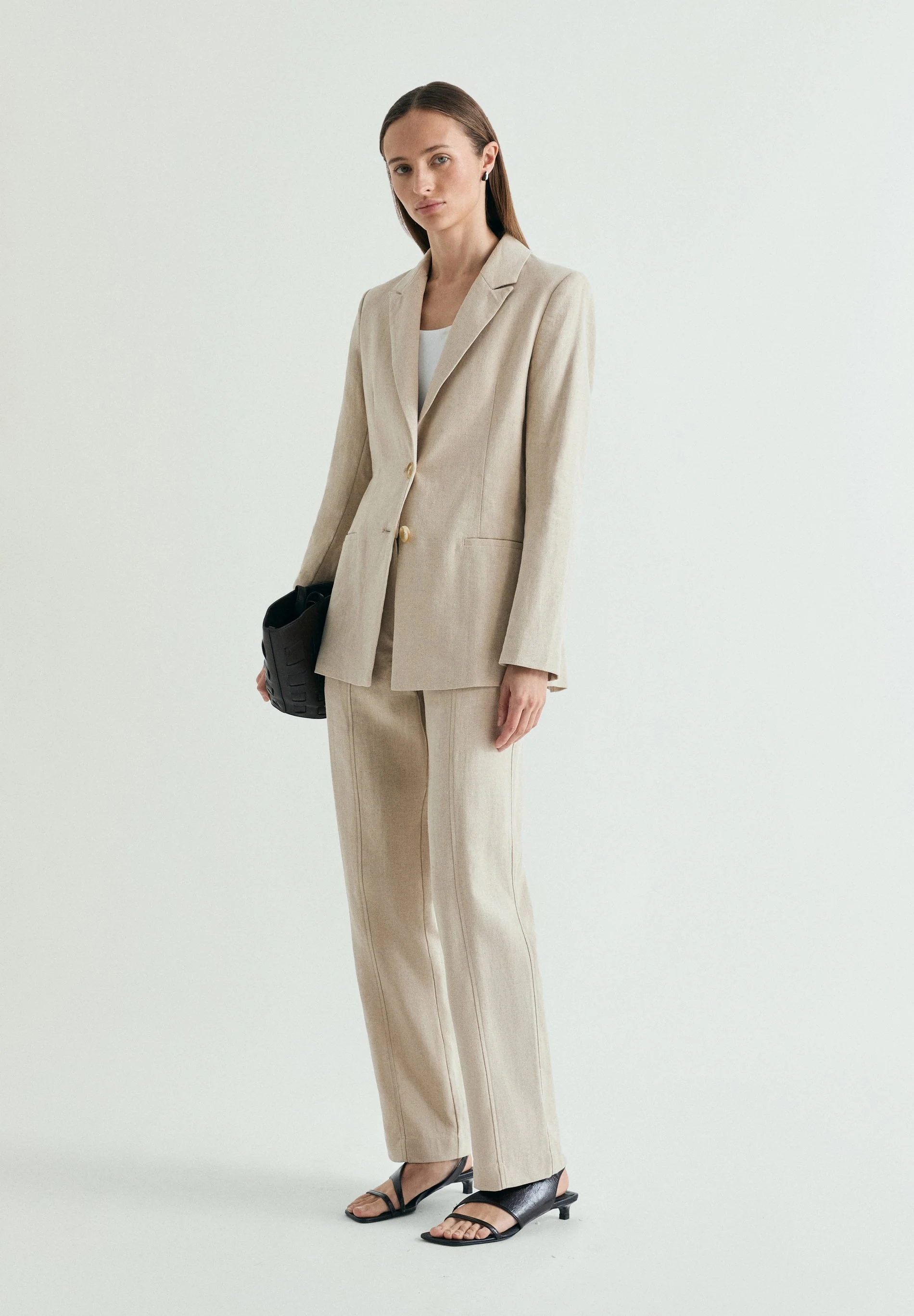 LINEN TROUSERS WITH METAL DETAILS